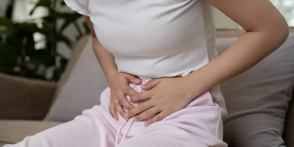Woman Experiencing Stomach Pain