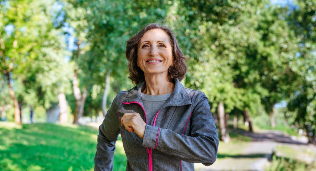 middle aged woman walking in the park